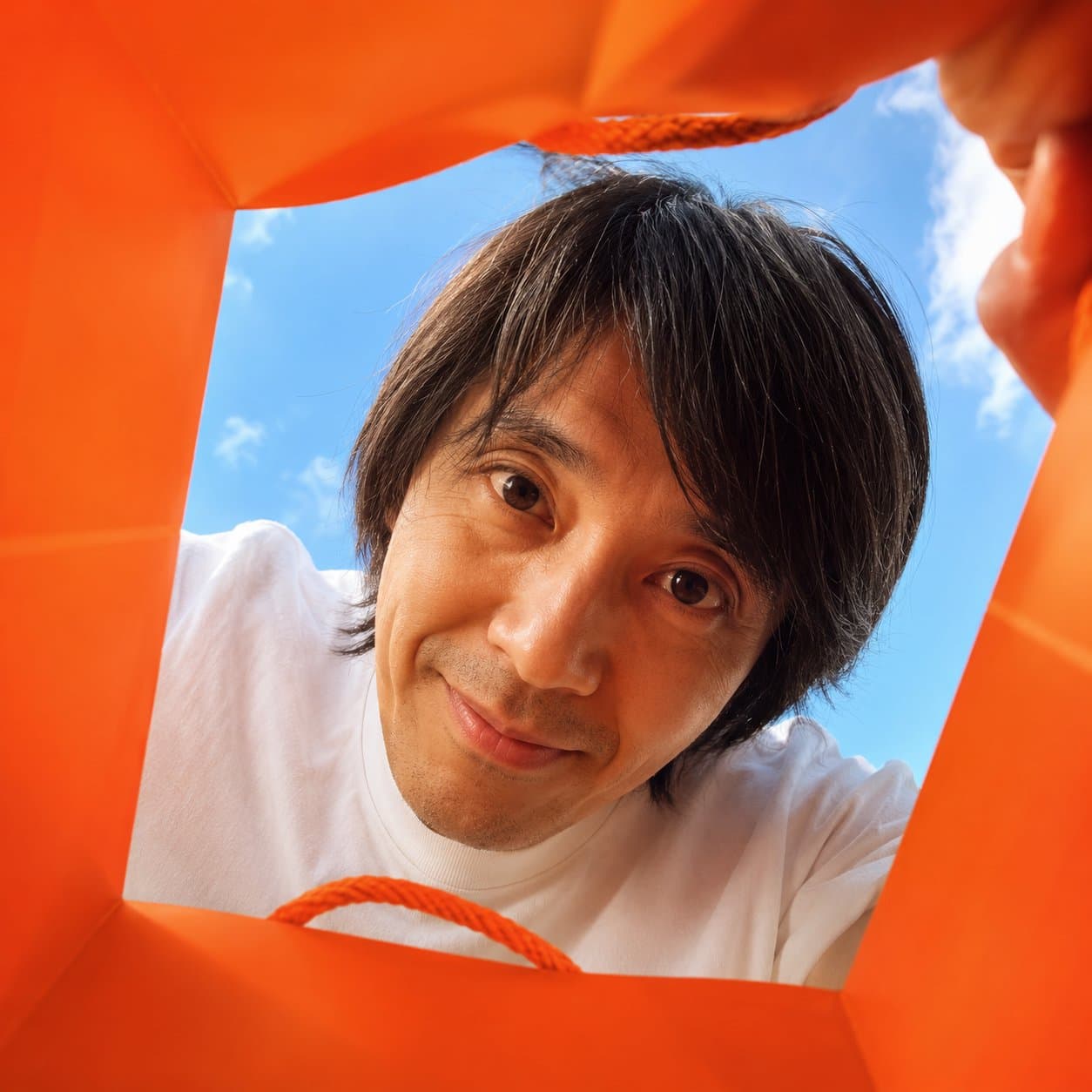 vibrant shopping bag upward wide-angle portrait